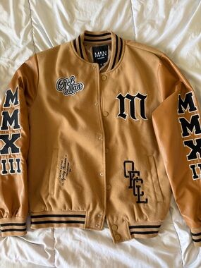 MAN Official Tan Varsity Jacket with Black Trim